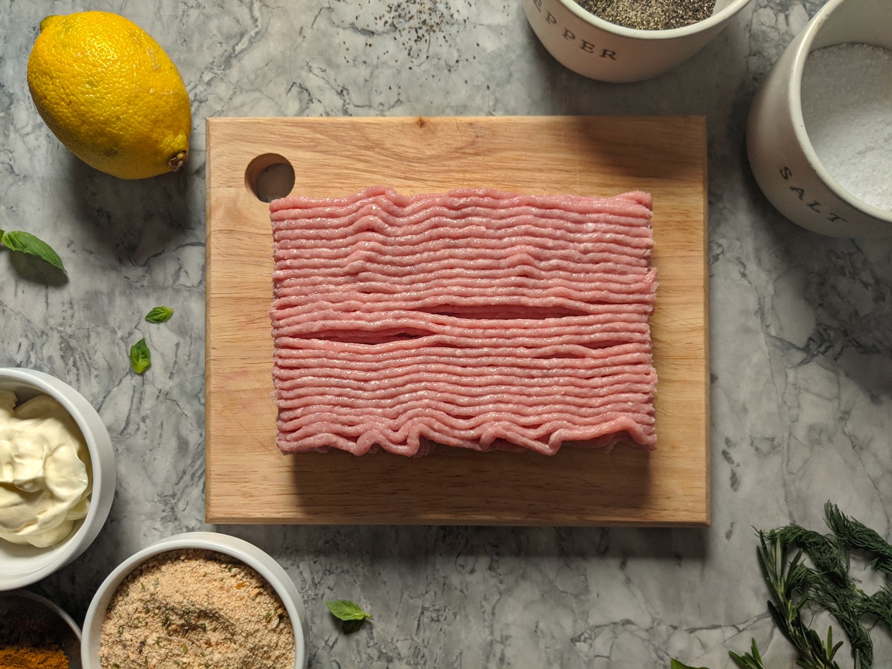 Raw ground turkey on a cutting board