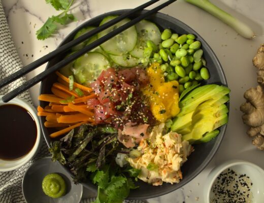 Overhead shot of plated poke bowl with tuna and imitation crab