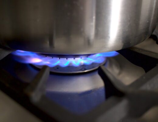 Closeup photo of lit cooktop burner