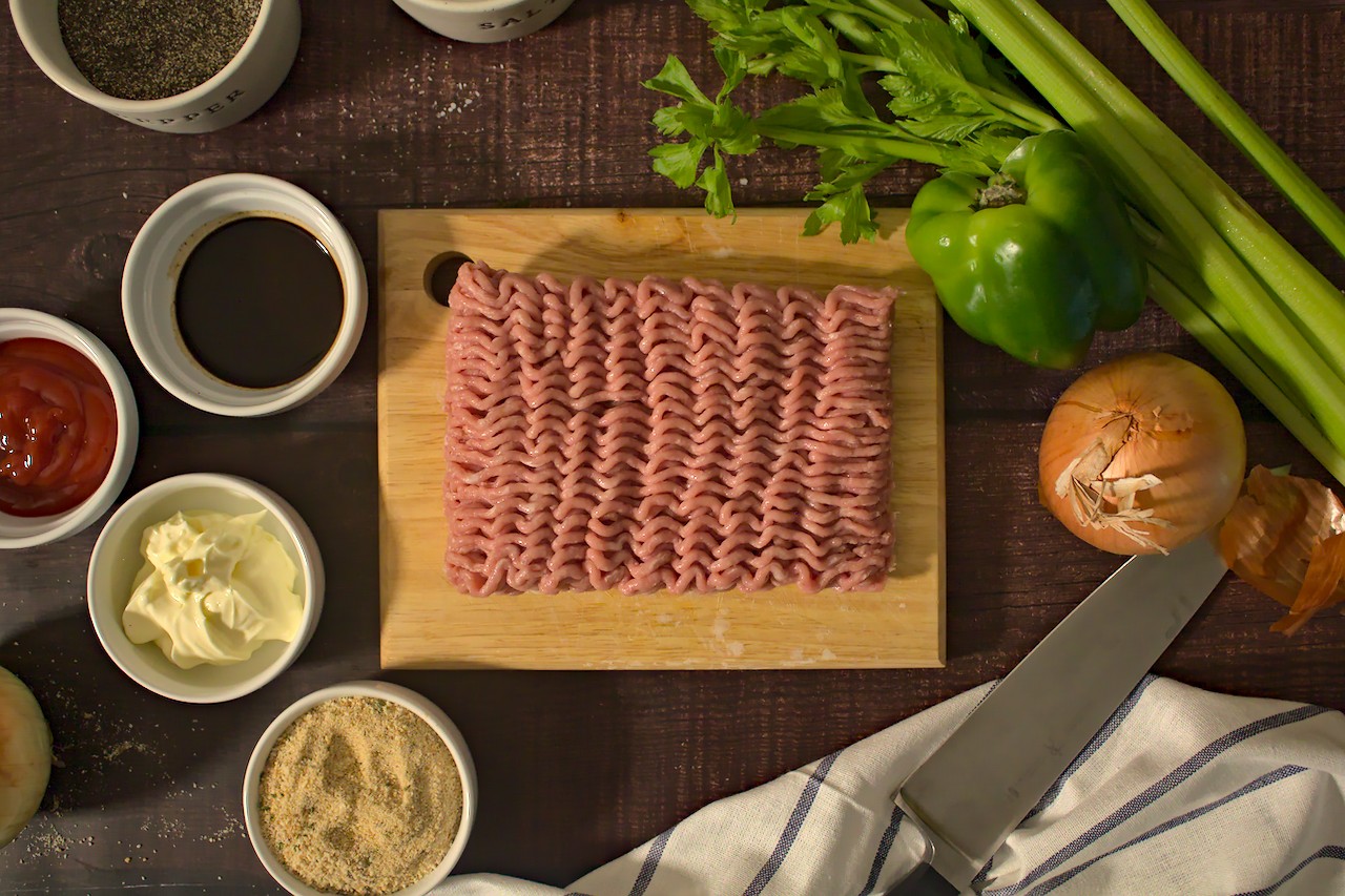 Overhead photo of raw ground turkey and meatloaf ingredients