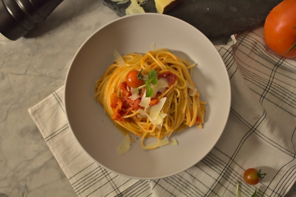 Overhead photo of plated bucatini pasta