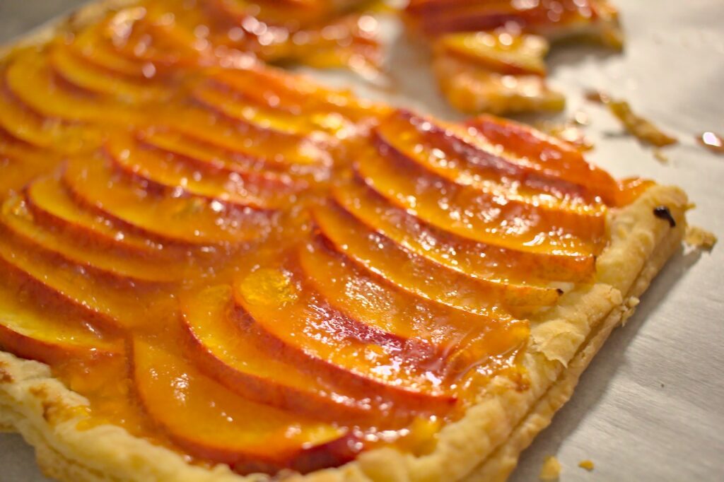 Closeup photo of nectarine and goat cheese tart