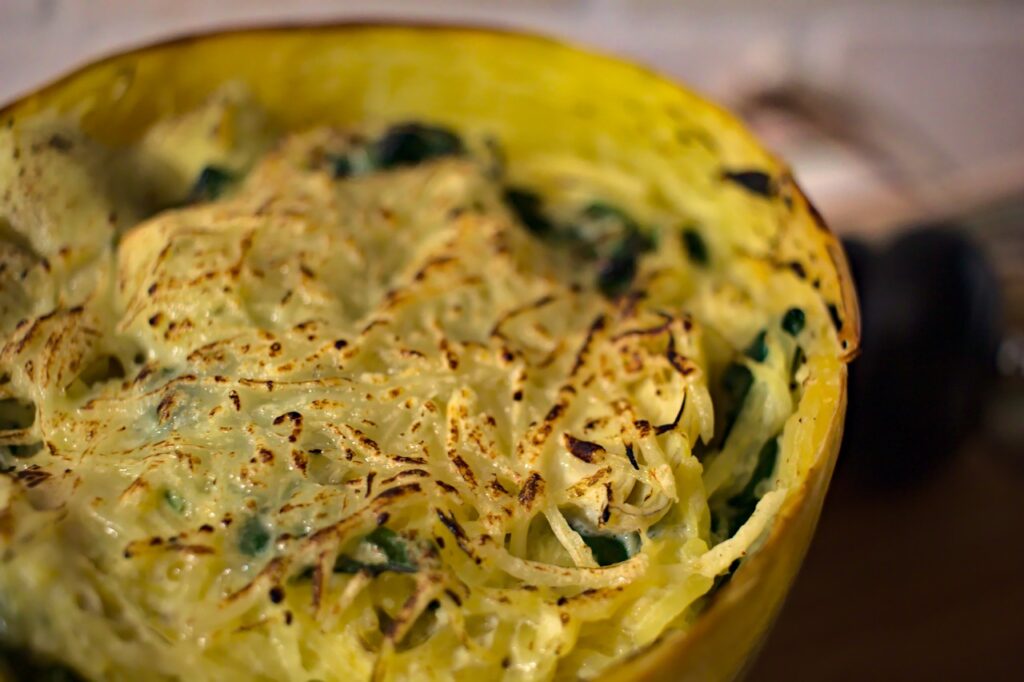 Closeup photo of spinach artichoke spaghetti squash