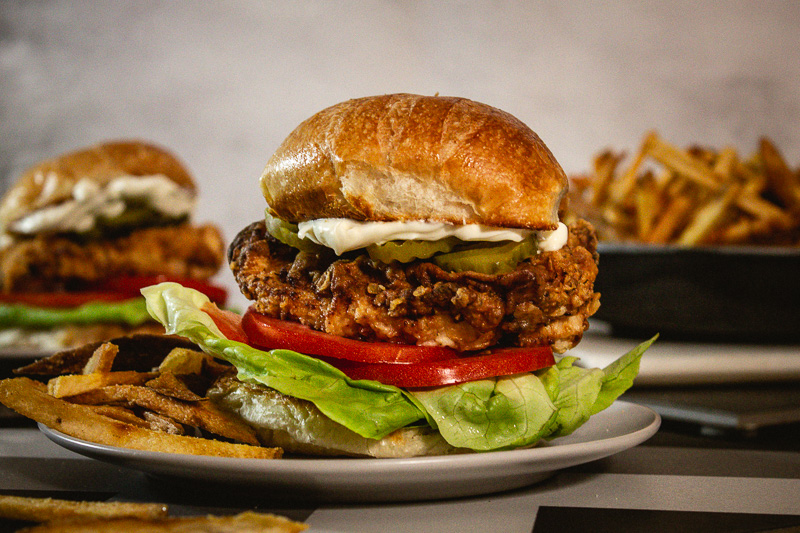 Photo of fried chicken sandwich with french fries